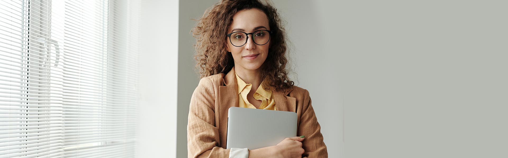 smart woman holding a laptop